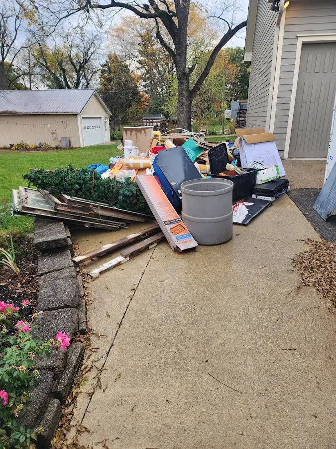 Dumpster being loaded with debris for 10 Yard Dumpster Rental in Bethlehem